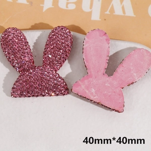 Detail of pink rhinestone rabbit ear patches for DIY crafts with 40mm size measurements