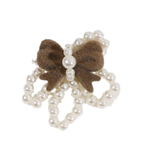 Brown flocked bow hair accessory with white pearl flower design on white background