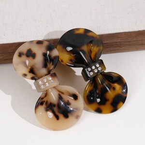 Tortoise shell bow hair clips with sparkling crystals in dark and light brown tones