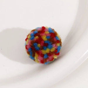 Macro view of 30mm colorful plush pom-pom balls for DIY jewelry and crafts