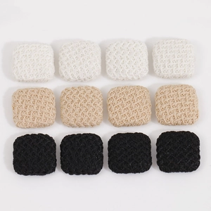 Detailed view of square plaid fabric buttons in black, white and beige colors