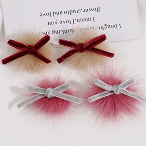 Handmade velvet bow hair accessories with faux fur balls in red and pink colors