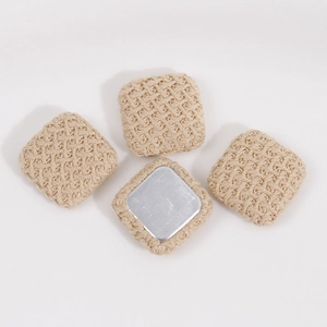 Detailed view of square woven fabric accessory with metal base for DIY jewelry making