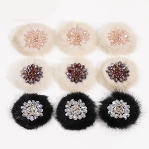 Close-up of handmade plush flower patches with crystal beads for DIY jewelry and hair accessories