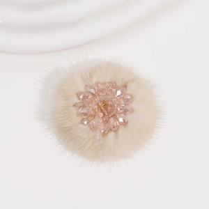 Close-up of handmade plush flower accessory with pink crystal beads for DIY jewelry
