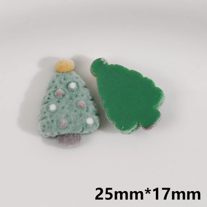 Detail of green flocked Christmas tree resin DIY charms with dimensions 25mm by 17mm