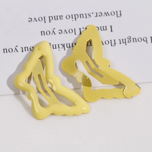Macro di fermagli per capelli a farfalla in metallo giallo con finiture smalto e opache