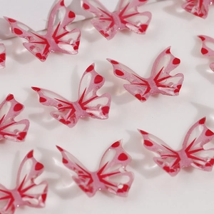 Pink translucent butterfly charms with glitter finish and red wing patterns for DIY jewelry