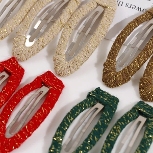 Handmade woven fabric hair clips with gold metallic thread in vintage festive colors