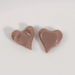 Detail view of mocha brown resin heart charms for DIY jewelry making accessories