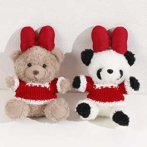Cute plush bear and panda dolls with large red bows and cozy knitted sweaters