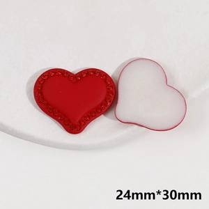 Detail view of a 24mm*30mm red rhinestone heart DIY patch showing front and back texture