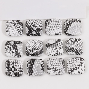 Detail of square black and white snake skin pattern resin charms for jewelry DIY crafts