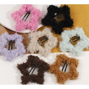Collection of colorful plush star-shaped hair clips with metal snap-on BB clips