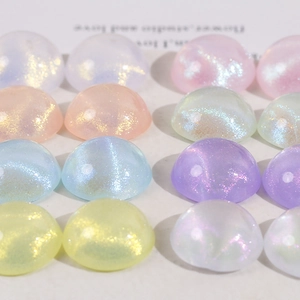 Macro shot of colorful glitter resin half-ball beads for DIY jewelry and accessories