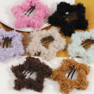 Set of 7 colorful plush star hair clips with soft faux fur texture and metal base