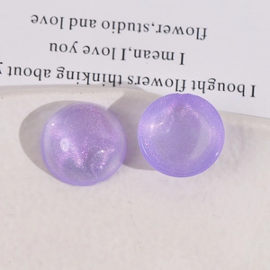 Macro detail of purple glitter acrylic cabochon for DIY jewelry making and crafts