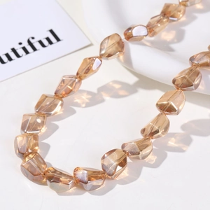 Detailed macro view of champagne faceted glass beads for DIY jewelry making and crafts