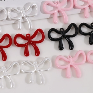 Lustrous pearl-finished resin bow pendants for DIY jewelry making in assorted colors
