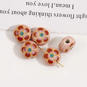 Detail of 12mm pink ceramic flower beads with gold edges for DIY jewelry making