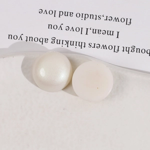 Macro view of 18mm matte pearl acrylic flatback beads for DIY jewelry and accessories