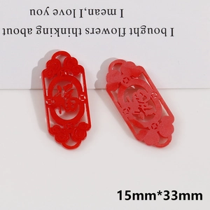 Detail of red hollow Chinese knot charms with Fu and Xi characters for DIY jewelry