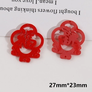 Close-up of red Fu character charms with glitter finish and 27mm size for DIY crafts