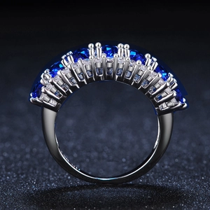Elegant silver ring featuring a sparkling array of AAA blue zircons and white stones