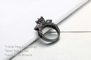 Detail of gothic black gun plated skull ring with purple AAA+ cubic zirconia stones