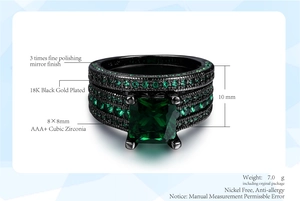 Macro detail of black gold emerald cut green zircon ring set with pave small stones