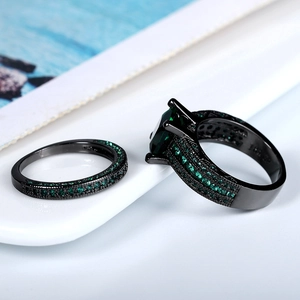 Vintage black gold plated ring set with emerald cut green zircon and pavé crystals