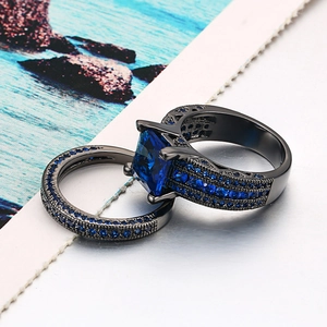 Elegant black gold ring set with square blue gemstone and micro-pave sapphire cubic zirconia