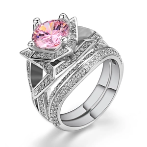 Detail of double-layer silver rings set featuring a large round pink zircon center stone