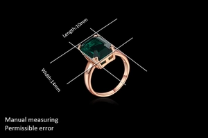 Detail view of emerald-cut green gemstone ring in rose gold, size 10x14mm dimensions