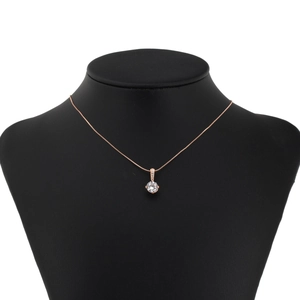 Classic rose gold pendant necklace with brilliant cubic zirconia on a black jewelry bust