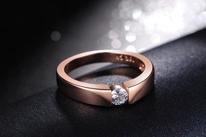 Macro shot of rose gold plated S925 silver ring featuring a solitaire round cut zircon