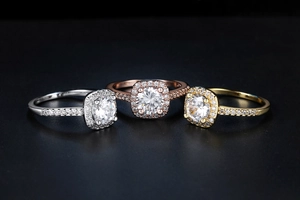 Detail view of classic zircon engagement rings set in silver, gold, and rose gold finishes