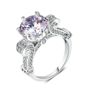 Macro view of silver ring featuring AAA zircon center stone and intricate filigree details