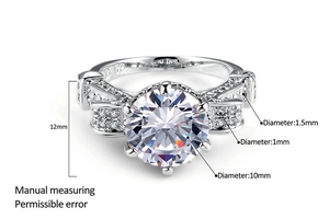Detailed view of six-prong ring with 10mm round cubic zirconia and side stones