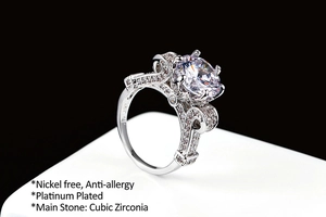 Macro view of platinum plated ring with cubic zirconia and filigree details