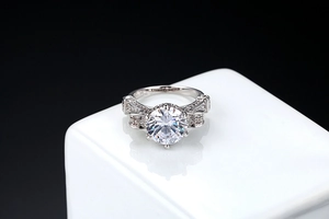 Macro shot of S925 engraved stamp and sparkling AAA zircon on a silver-toned metal ring