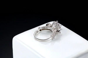 Macro view of S925 silver ring featuring pink round stone and intricate zircon pavé