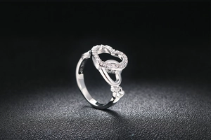 Macro shot of S925 sterling silver heart ring with sparkling cubic zirconia stones