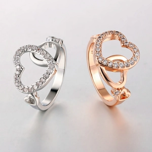 Classic interlocking heart rings in rose gold and silver with sparkling cubic zirconia
