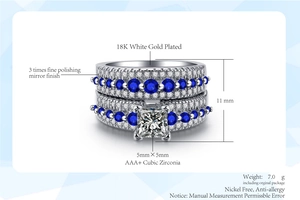 Detail of 18K white gold plated ring set with blue and white cubic zirconia stones
