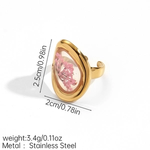 Detailed view of teardrop stainless steel ring with real pink dried flowers and dimensions