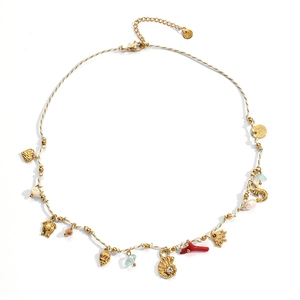 Bohemian woven chain necklace with seashells starfish pearls and marine charms on white background