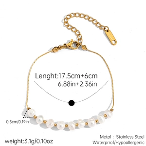 Detailed view of gold stainless steel bracelet with eight natural freshwater pearls