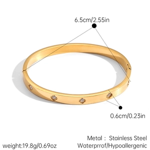 Spécifications techniques montrant le diamètre de 6,5 cm et la largeur du jonc doré