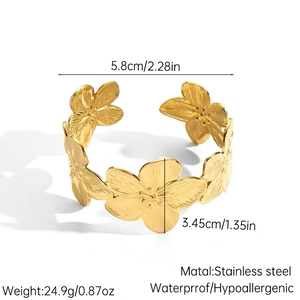 Polished gold stainless steel open cuff bracelet with five detailed floral motifs